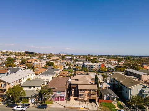 A residential area with houses and cars.