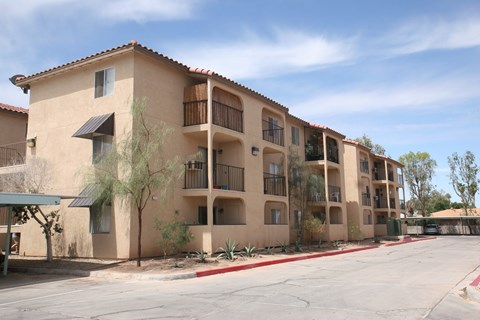 A building with a red roof and a balcony.