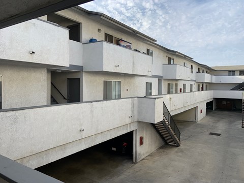A concrete building with multiple floors and staircases.