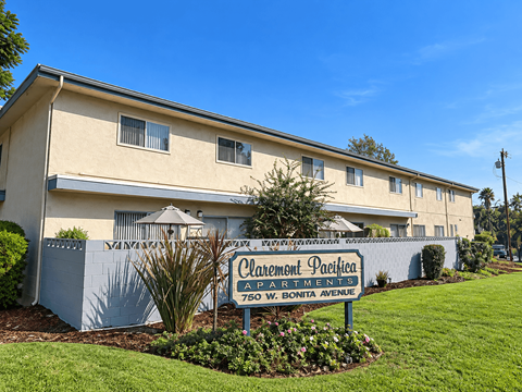 A building with a sign that says Claremont Pacifica Apartments.