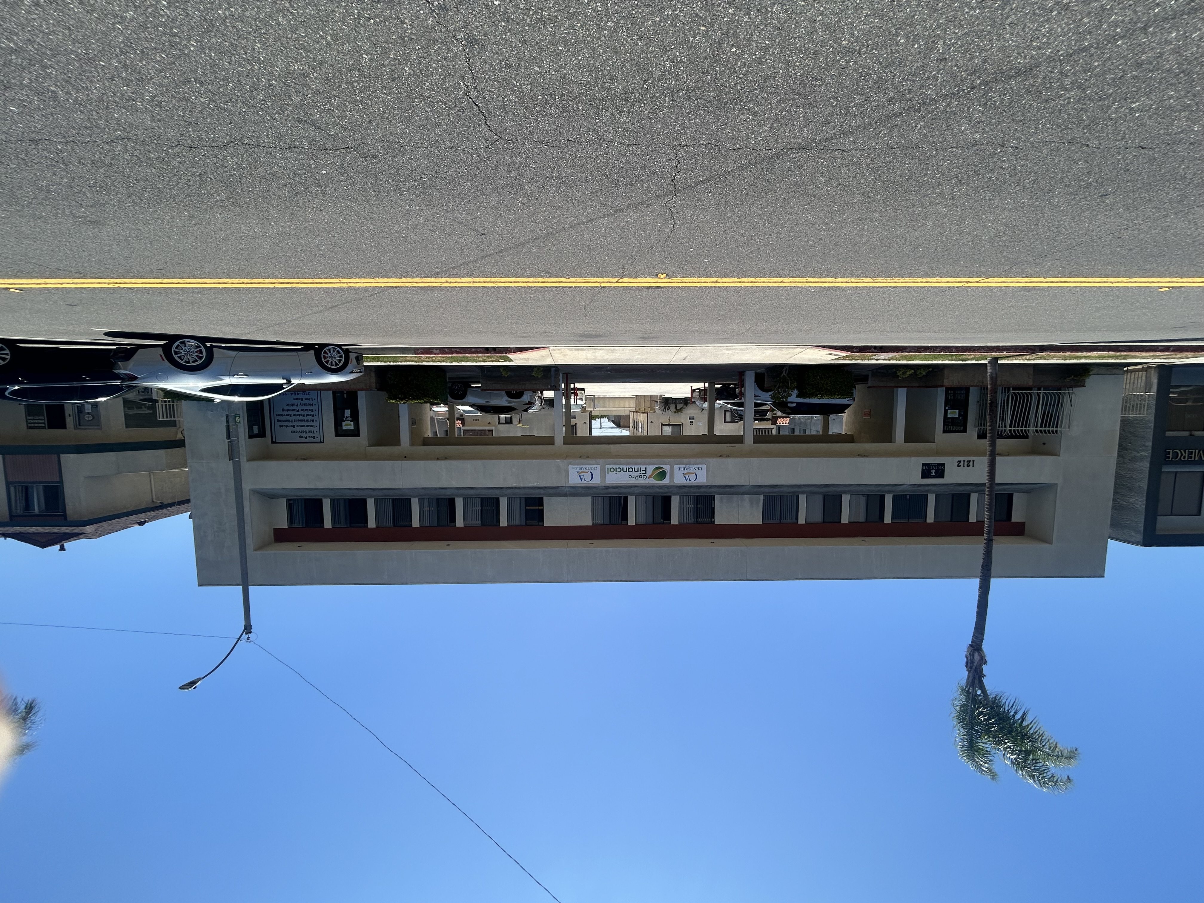A building with a yellow line on the ground.