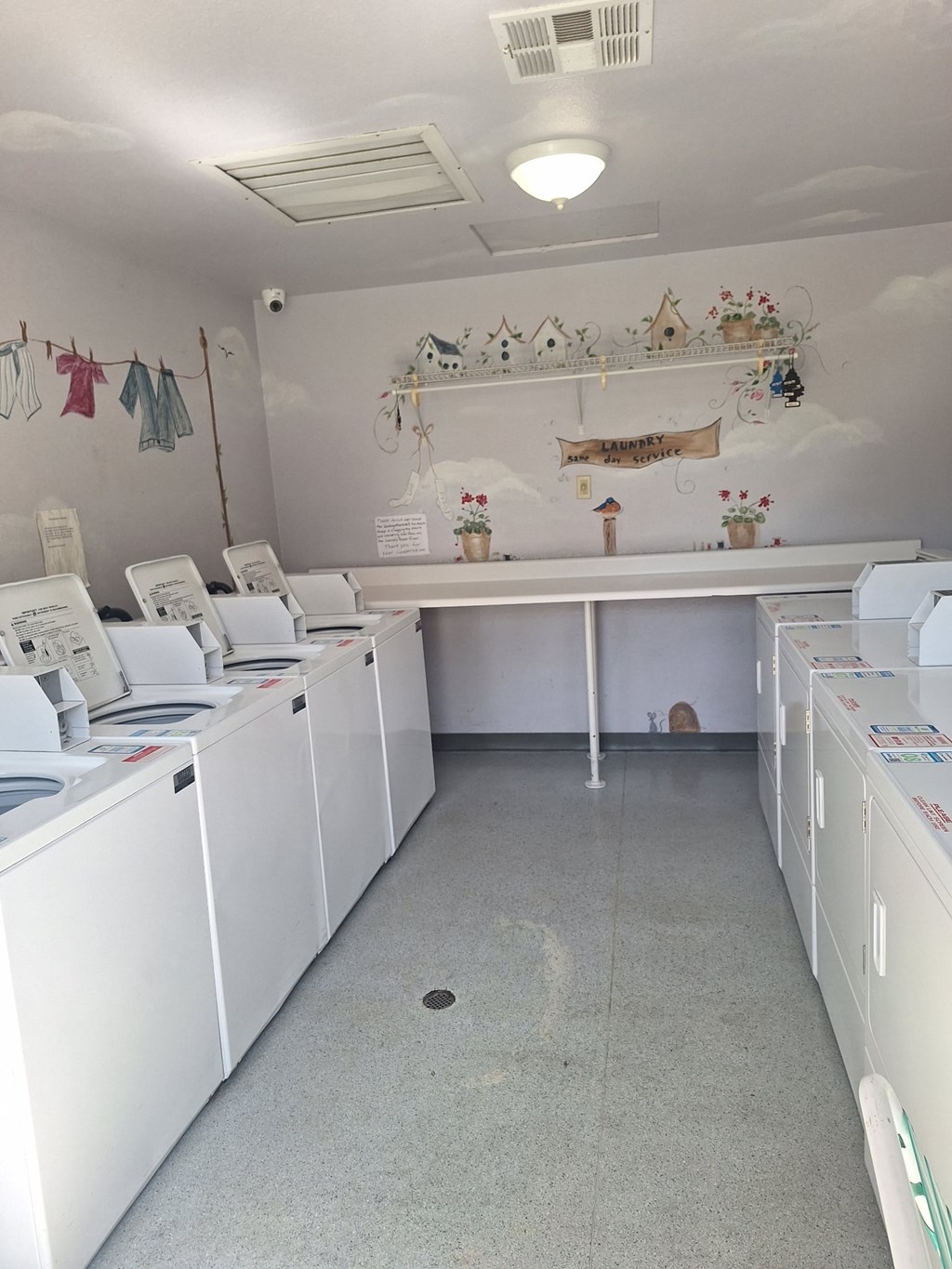 A laundromat with washers and dryers.