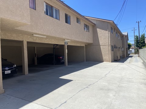 A parking garage with cars parked in it.