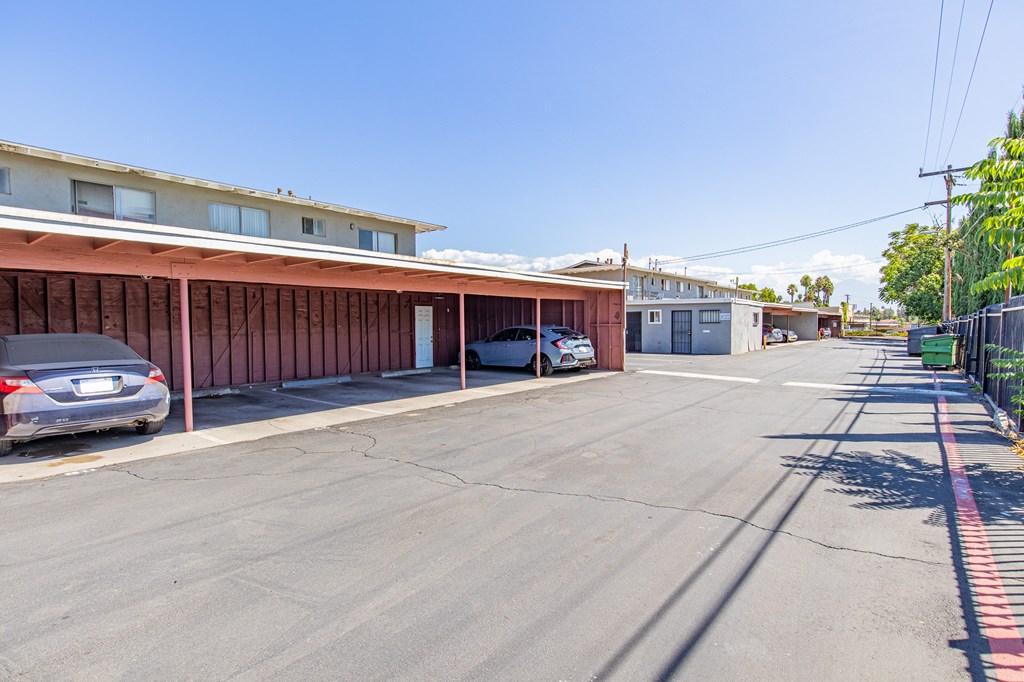 A parking lot with a building in the background.