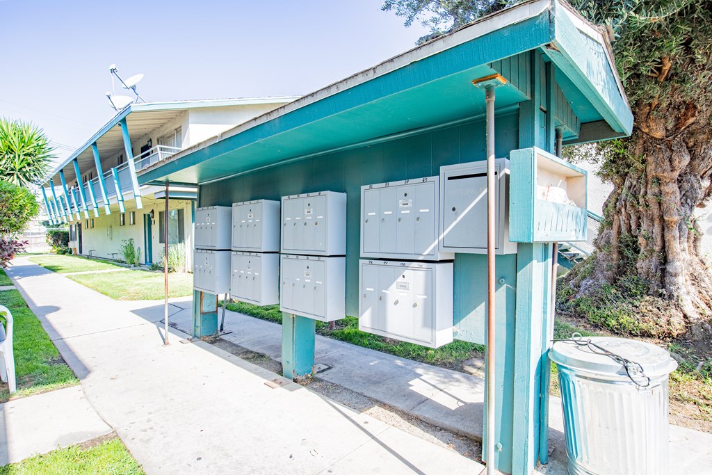A blue and white building with a green roof.