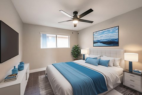 A bedroom with a bed, a ceiling fan, and a painting on the wall.