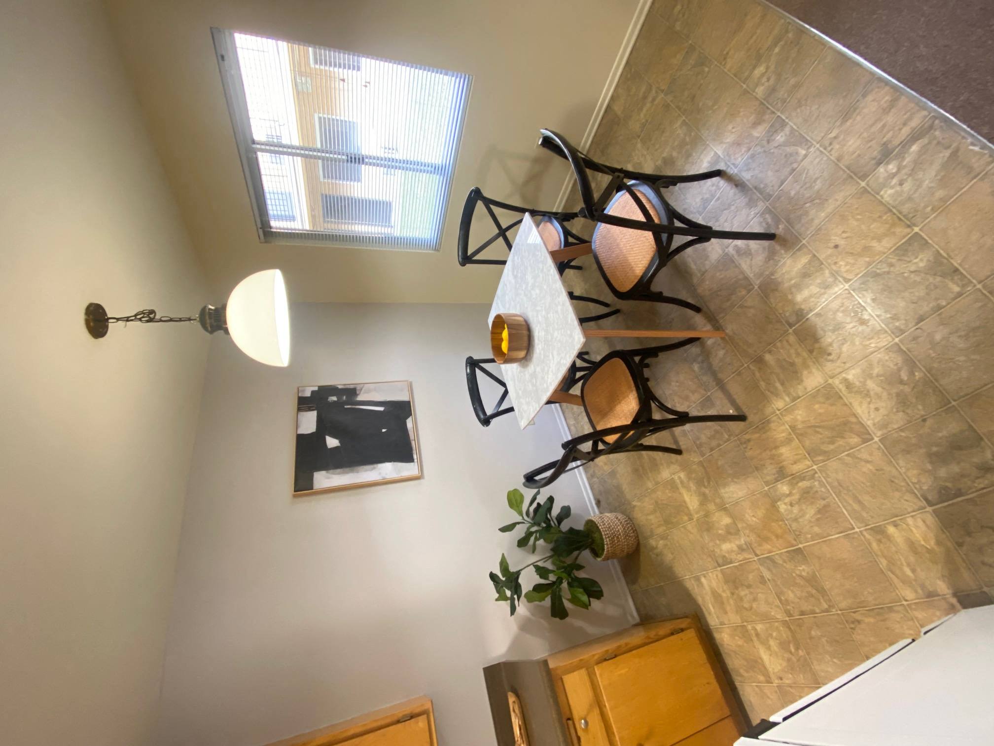 a view of a bathroom with a shower and a lighting fixture at Bowles Apts, Azusa, CA