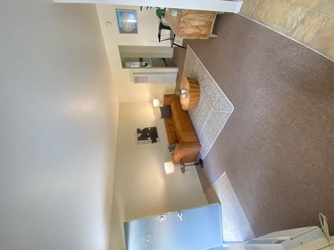 a view from above of a living room and a kitchen