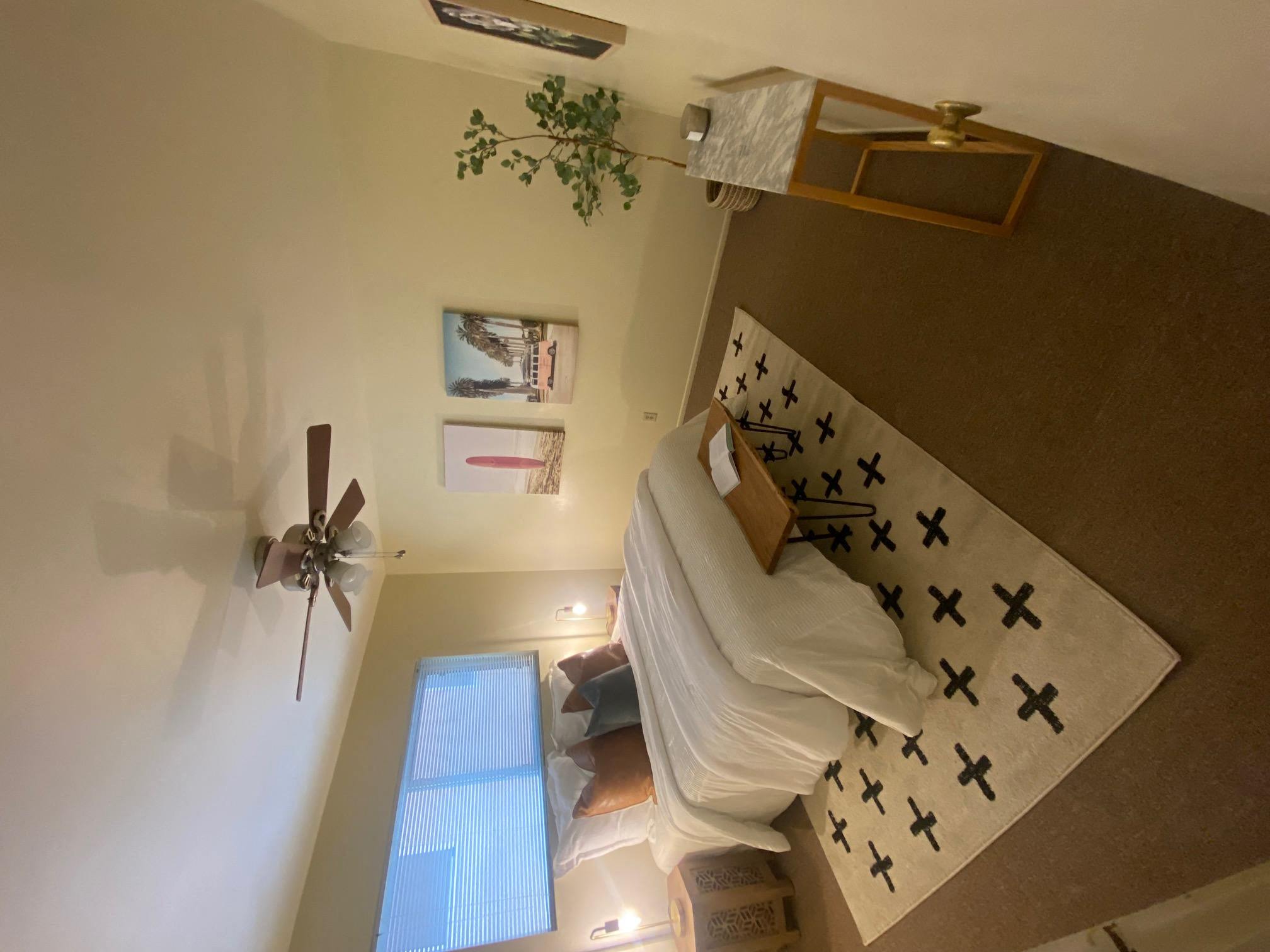 an overhead view of a bedroom with a bed and a ceiling fan at Bowles Apts, Azusa California