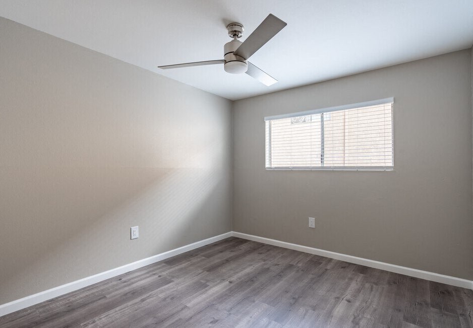 an empty room with a ceiling fan and a window at North View Terrace, California