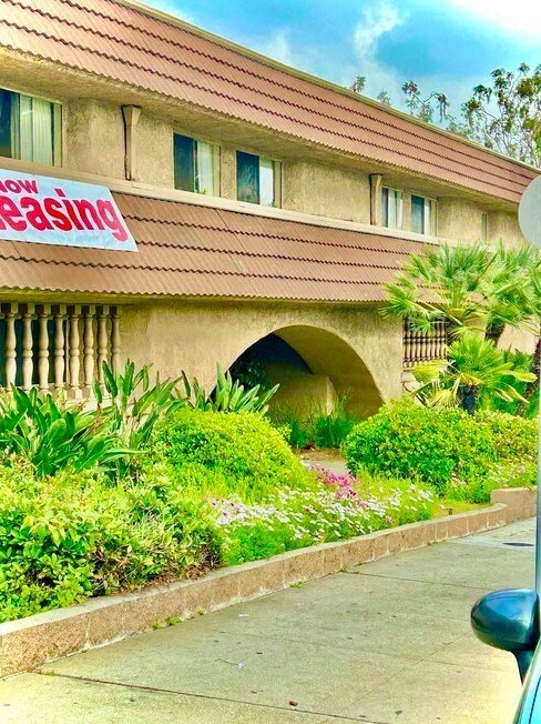 a building with a sign on the side of it at North View Terrace, Montebello, 90640