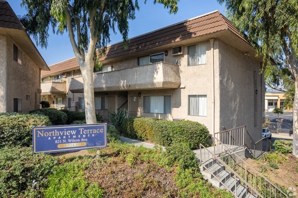a building with a blue sign in front of it at North View Terrace, California, 90640