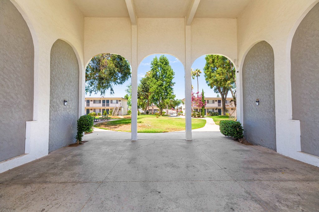the archway of a building with a view of the grass at Sunnymead Apts Apartments, Moreno Valley, CA, 92553
