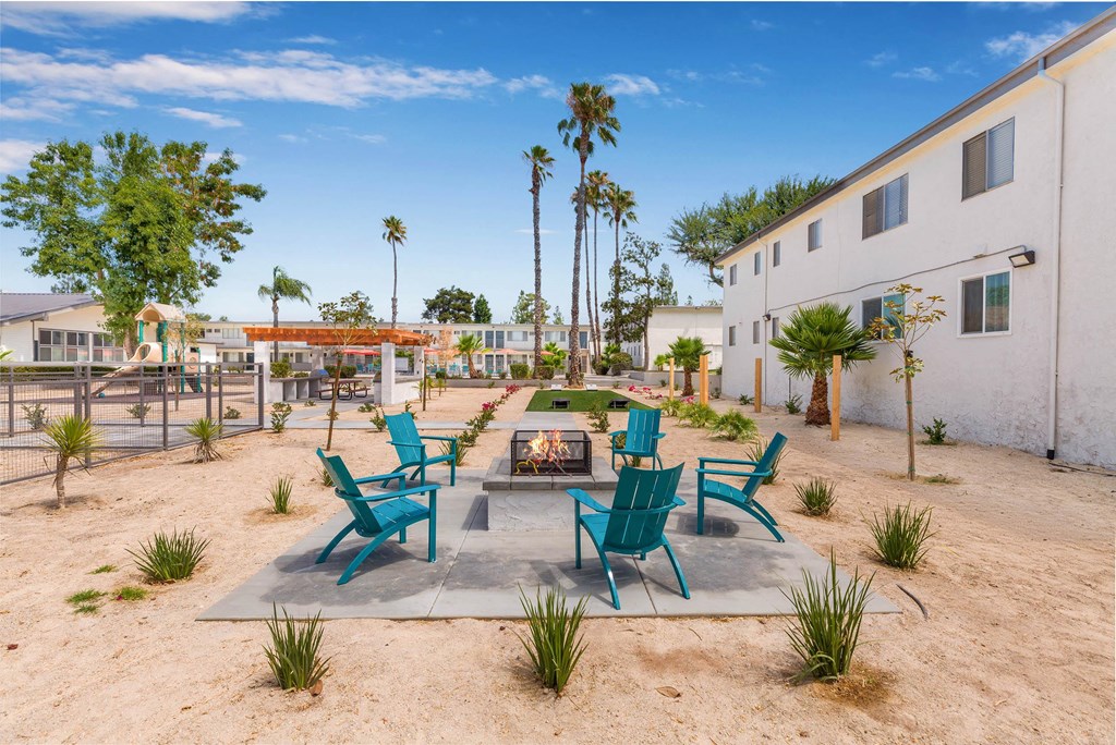 an outside patio with chairs and a fire pit at Sunnymead Apts Apartments, Moreno Valley, 92553