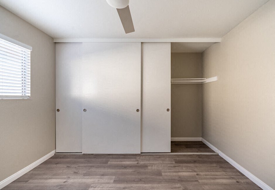 an empty room with a closet and a window at North View Terrace, Montebello