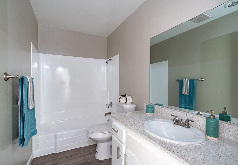 a bathroom with a sink toilet and a mirror at North View Terrace, Montebello, CA