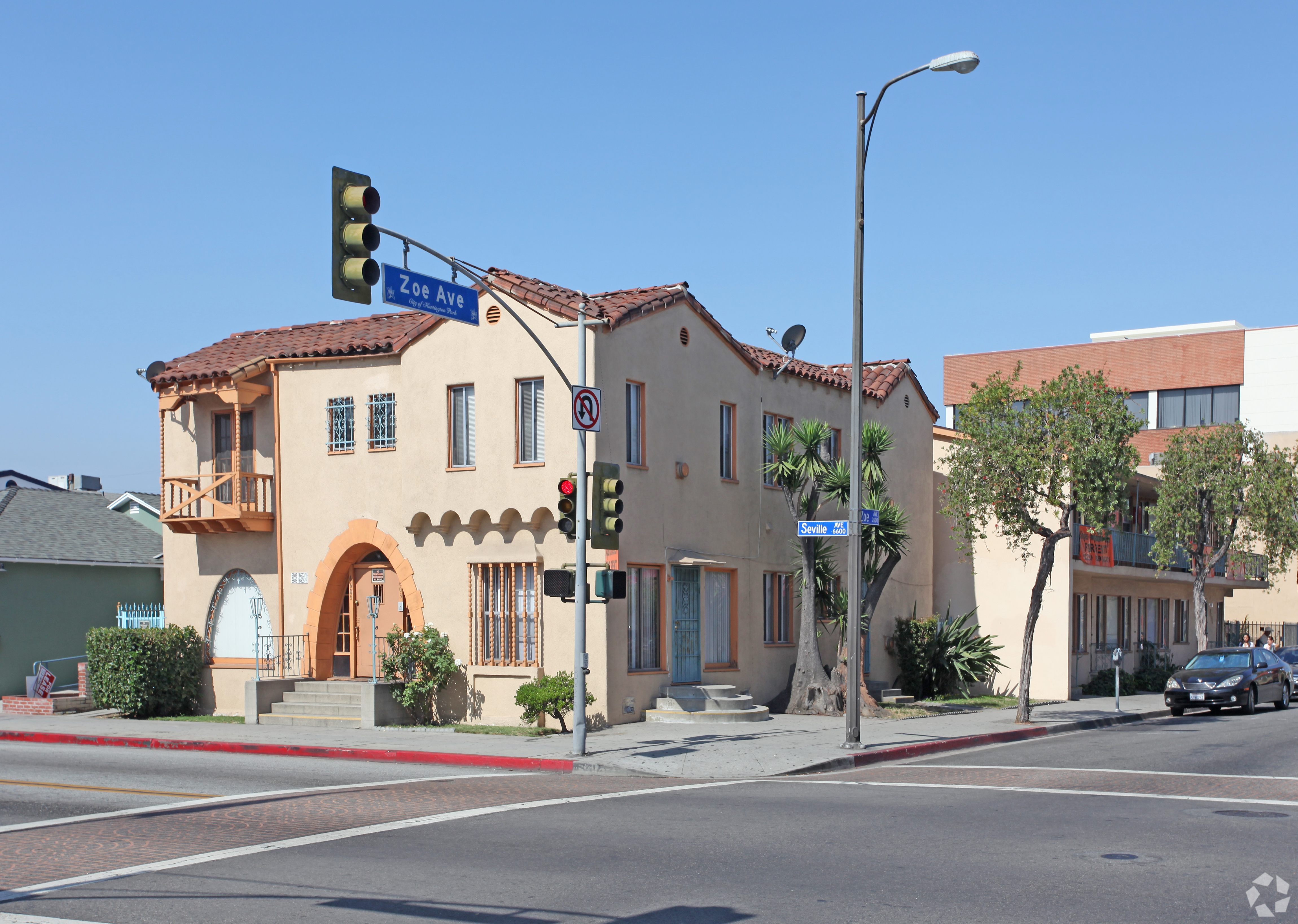 A street view of a building with a green traffic light.