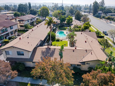A residential area with houses and a pool.