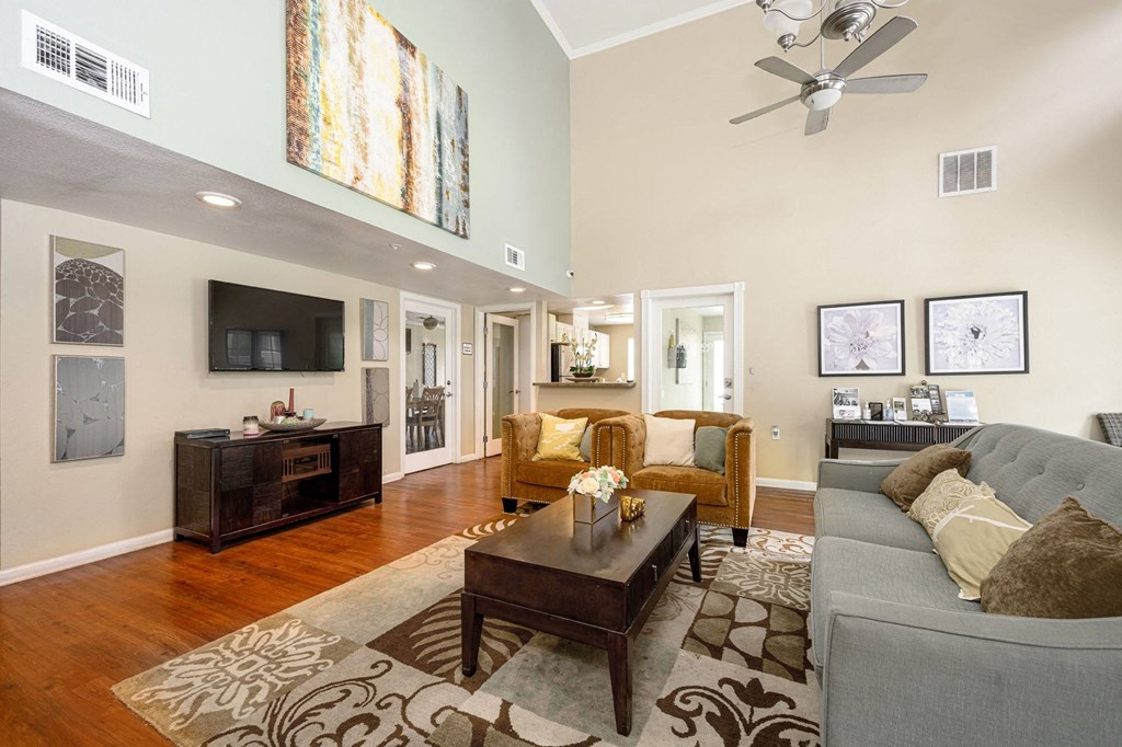 a living room filled with furniture and a ceiling fan at Sagewood Gardens Senior Apartments, California, 91745