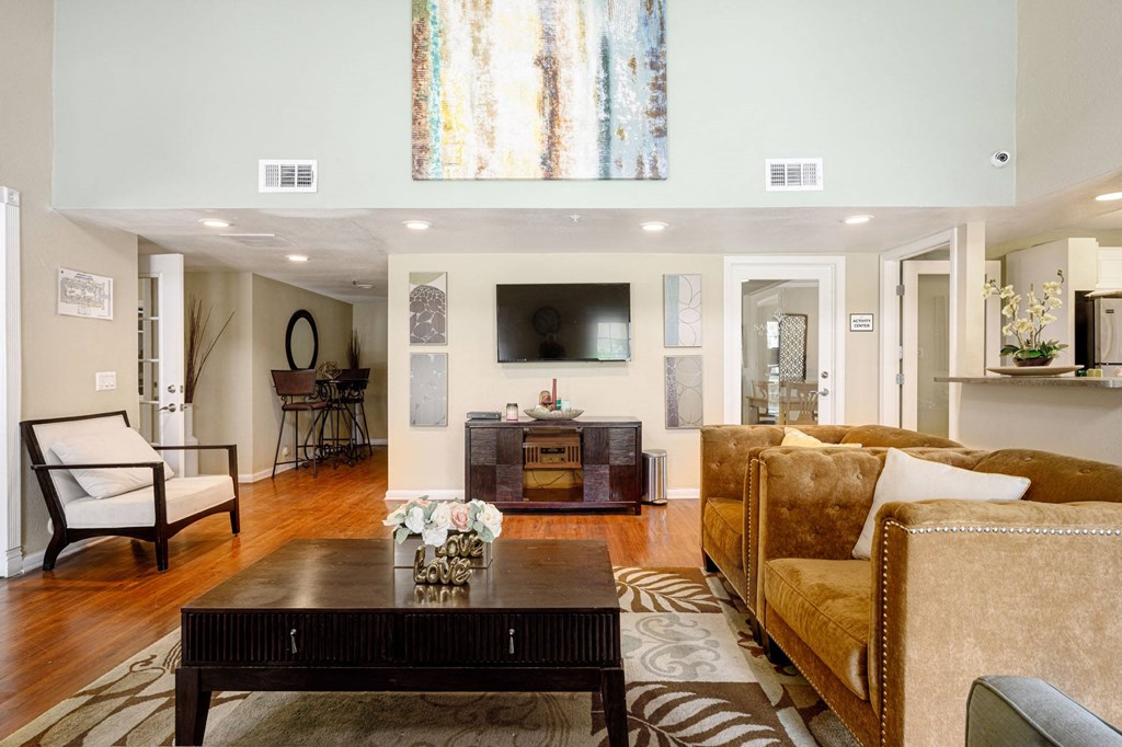 a living room filled with furniture and a flat screen tv at Sagewood Gardens Senior Apartments, Hacienda Heights