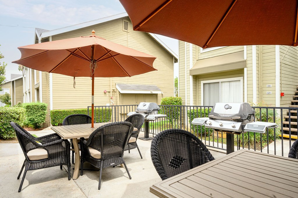 the reserve at bucklin hill patio with tables and chairs and a grill at Sagewood Gardens Senior Apartments, Hacienda Heights, CA