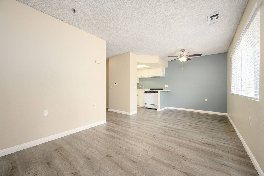 a bedroom with hardwood floors and a ceiling fan at Sagewood Gardens Senior Apartments, Hacienda Heights California