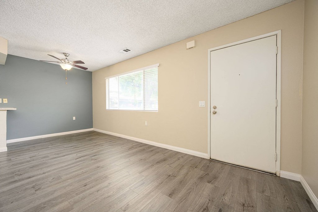 a bedroom with hardwood floors and a ceiling fan at Sagewood Gardens Senior Apartments, Hacienda Heights, CA