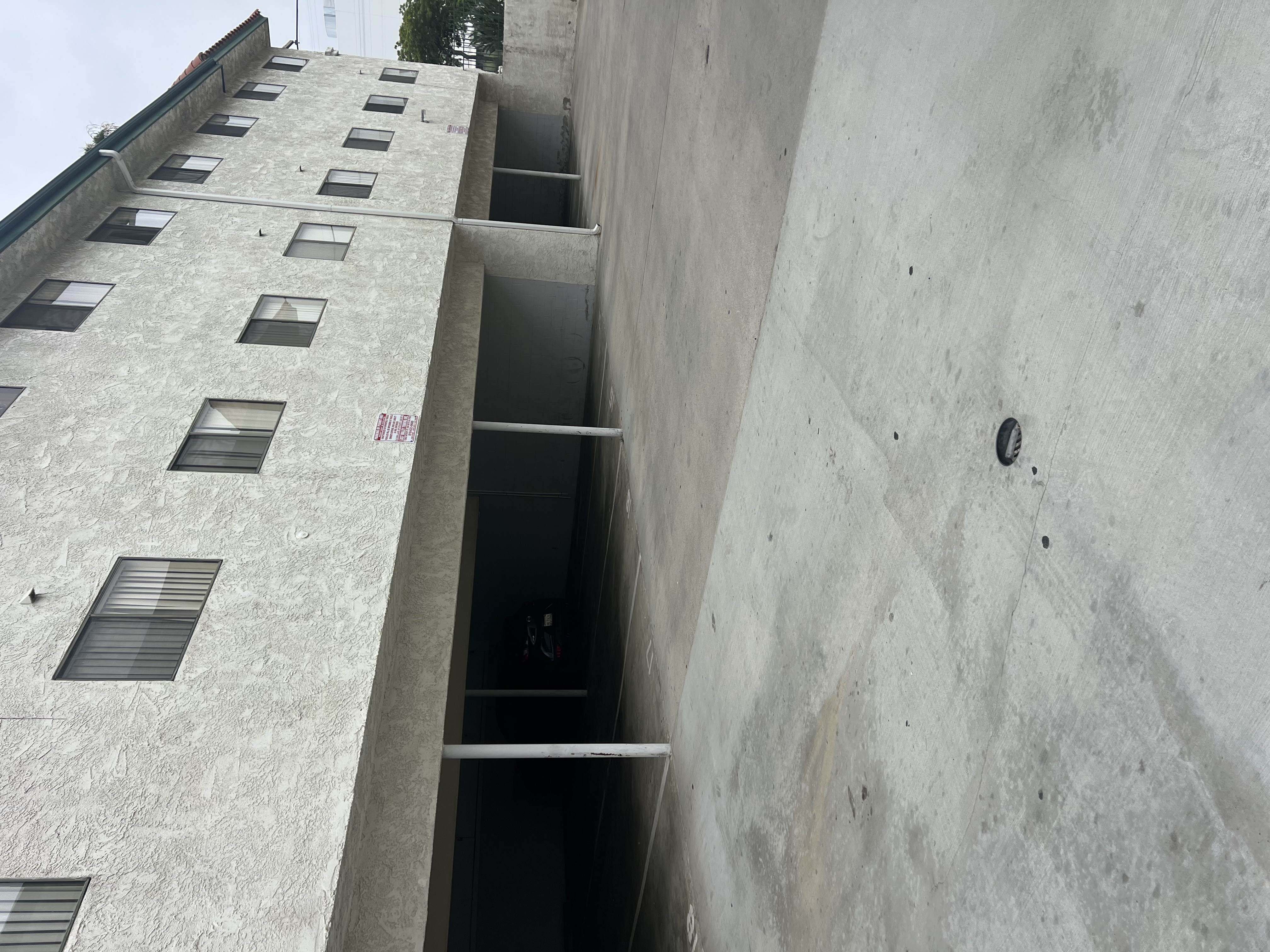 A concrete building with a lot of windows.