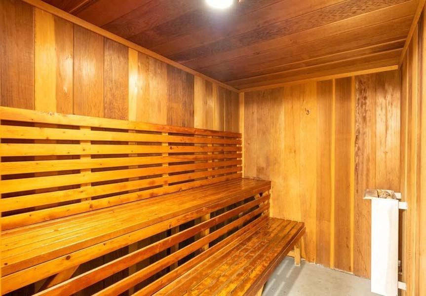 a sauna with a wooden bench and a trash can at Mountainview Venture, Covina California