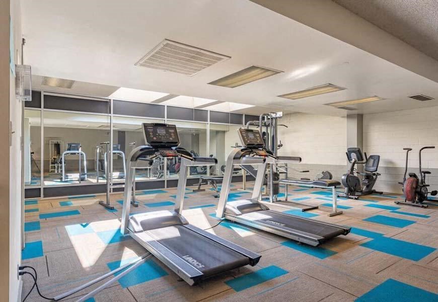 a gym with treadmills and other exercise equipment at Mountainview Venture, Covina