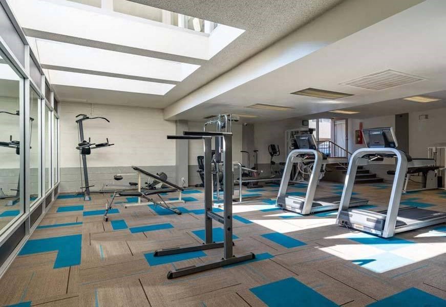 a gym with a lot of exercise equipment at Mountainview Venture, Covina California