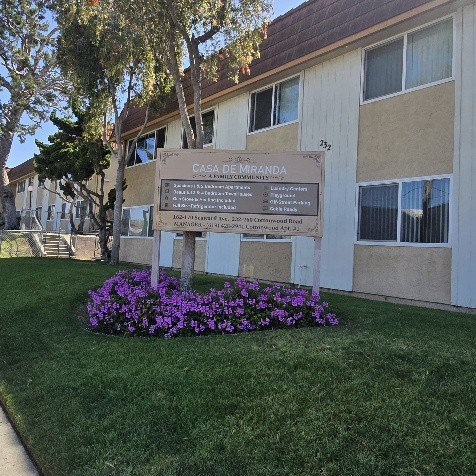 A sign in front of a building that says CAGA DE MRANDA.