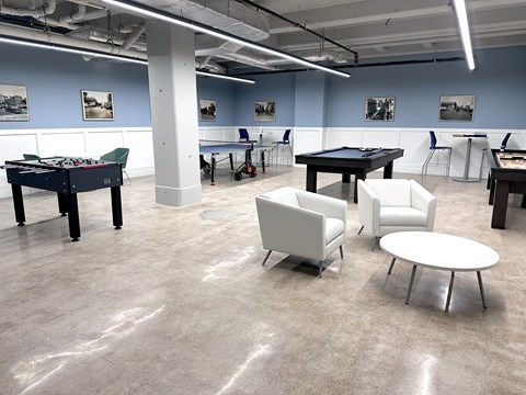 Recreation room with pool table and lounge seating at The Bell Apartments, Trenton, NJ 08608