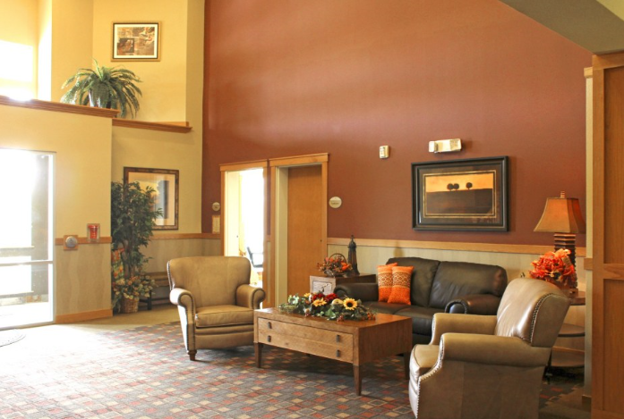 a living room with a couch chairs and a coffee table