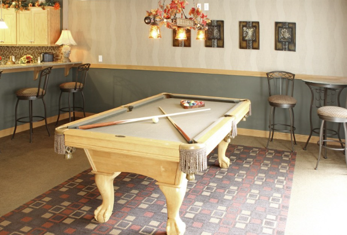 a billiards table in the community room
