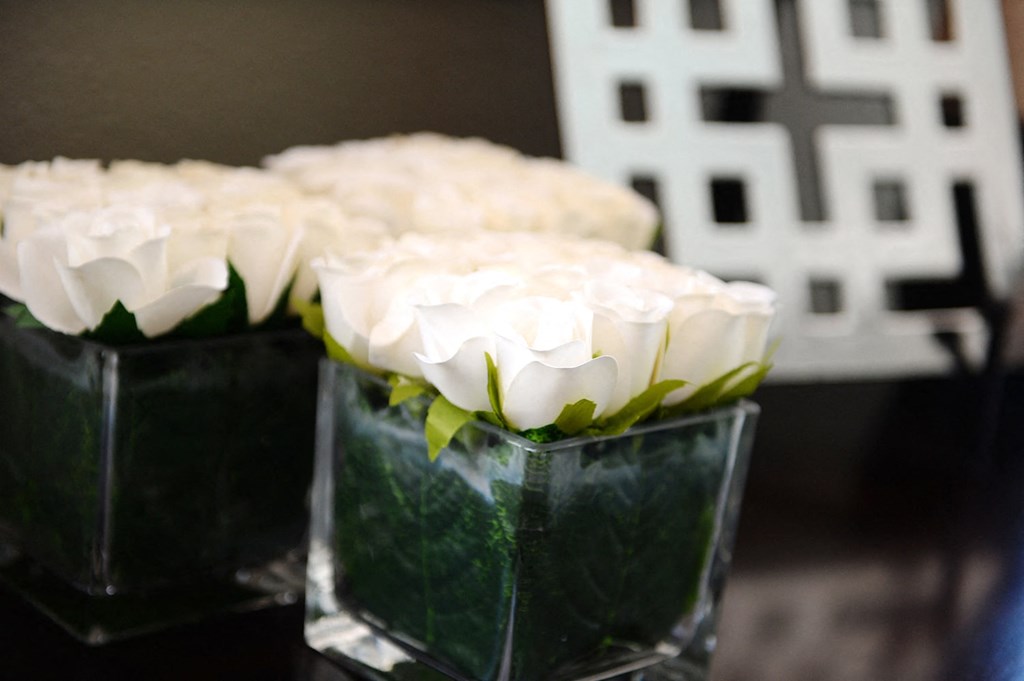 a vase of white flowers on a table at Hearthstone Apartments and Townhomes, Apple Valley, Minnesota