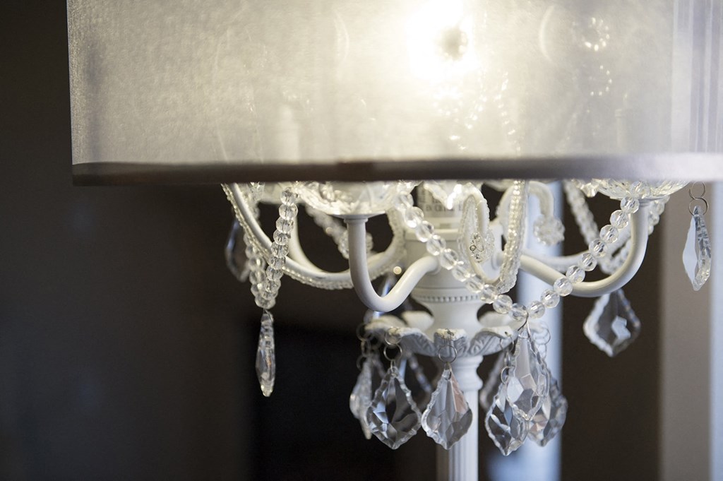 a close up of a white chandelier at Hearthstone Apartments and Townhomes, Apple Valley, MN