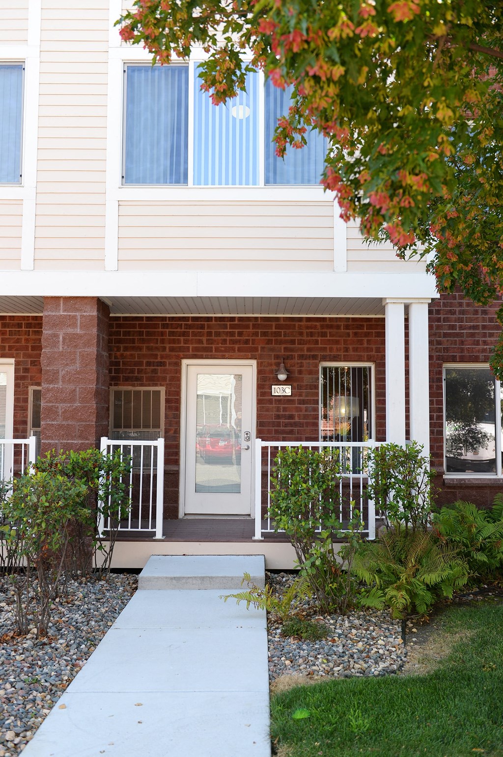 a view of the front of a townhome at Hearthstone Apartments and Townhomes, Apple Valley