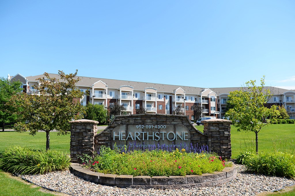 an image of the hearthstone apartments sign
