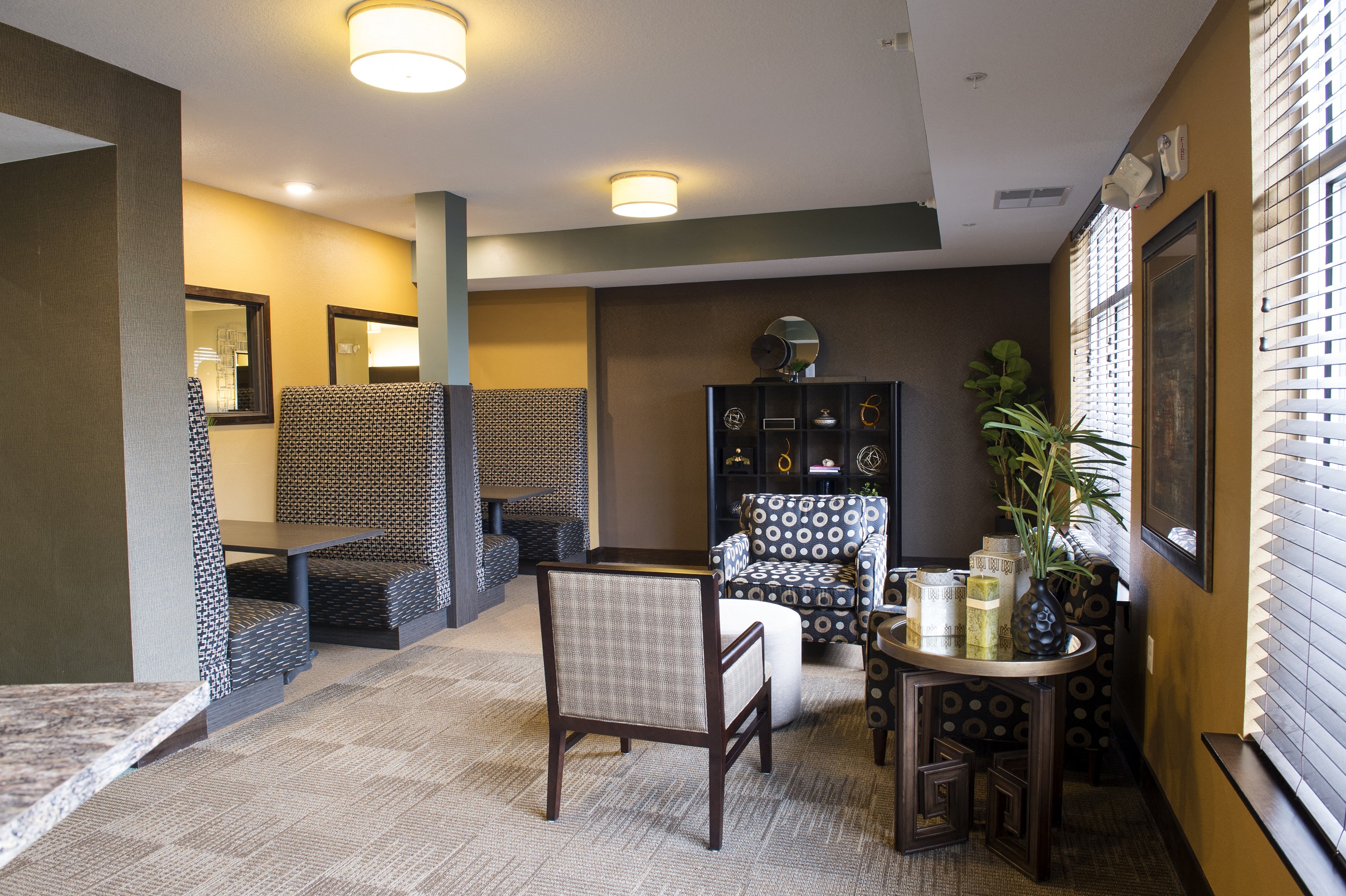 a room with a table and chairs in it at The Flats at Cedar Grove, Eagan, MN, 55122