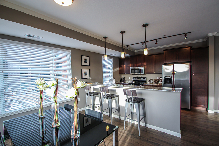 a kitchen and dining area  at Victoria Park and V2 Apartments, St. Paul, MN