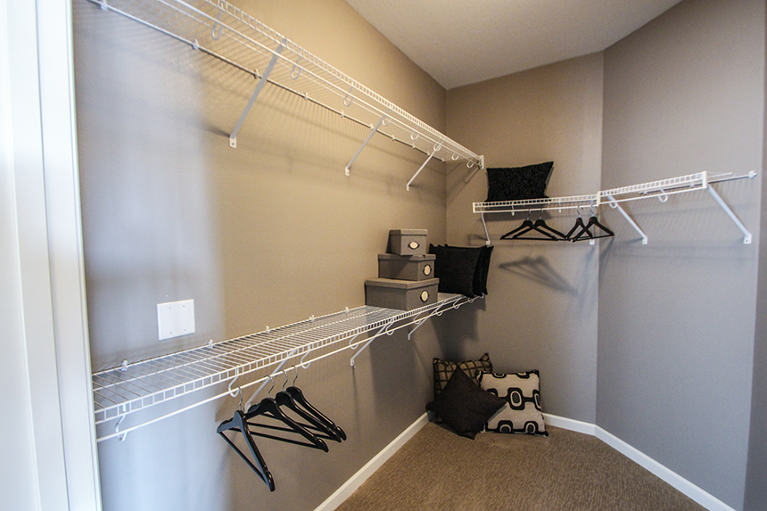 a walk in closet in a bedroom  at Victoria Park and V2 Apartments, St. Paul, MN, 55102