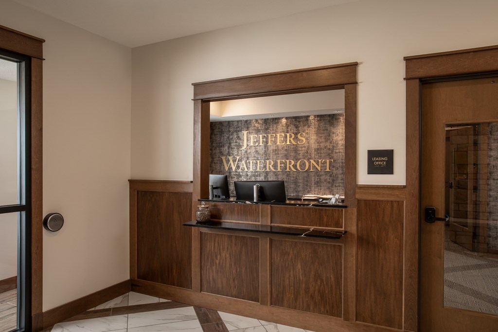 A reception area with a sign that says