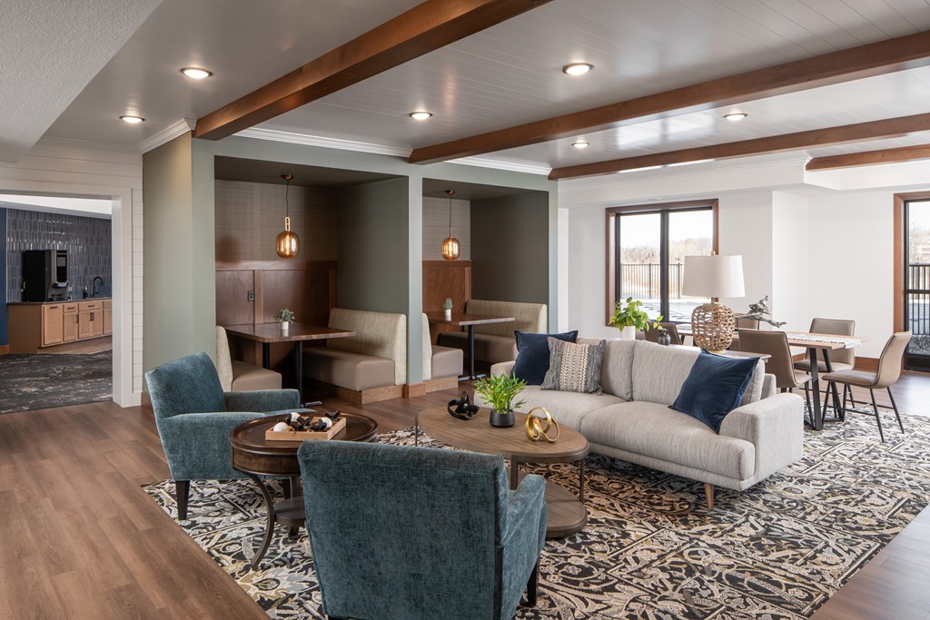 A modern living room with a large couch and a coffee table.
