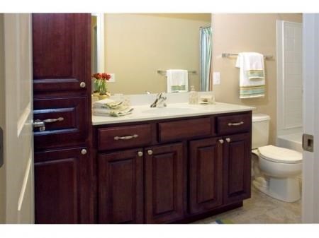 a bathroom with a toilet a sink and a mirror