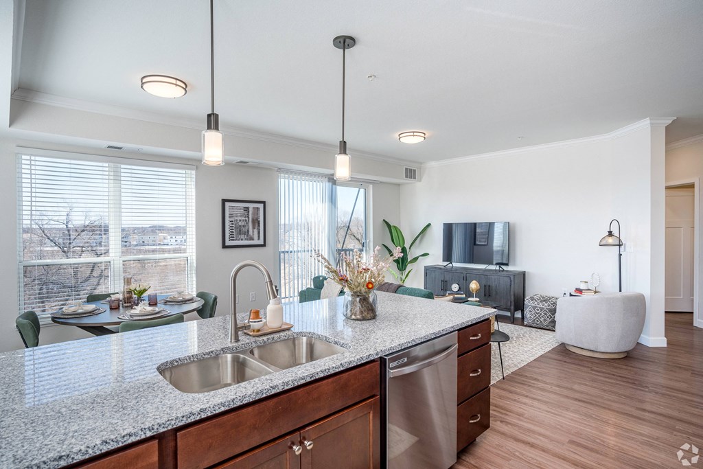 a kitchen view of a living room