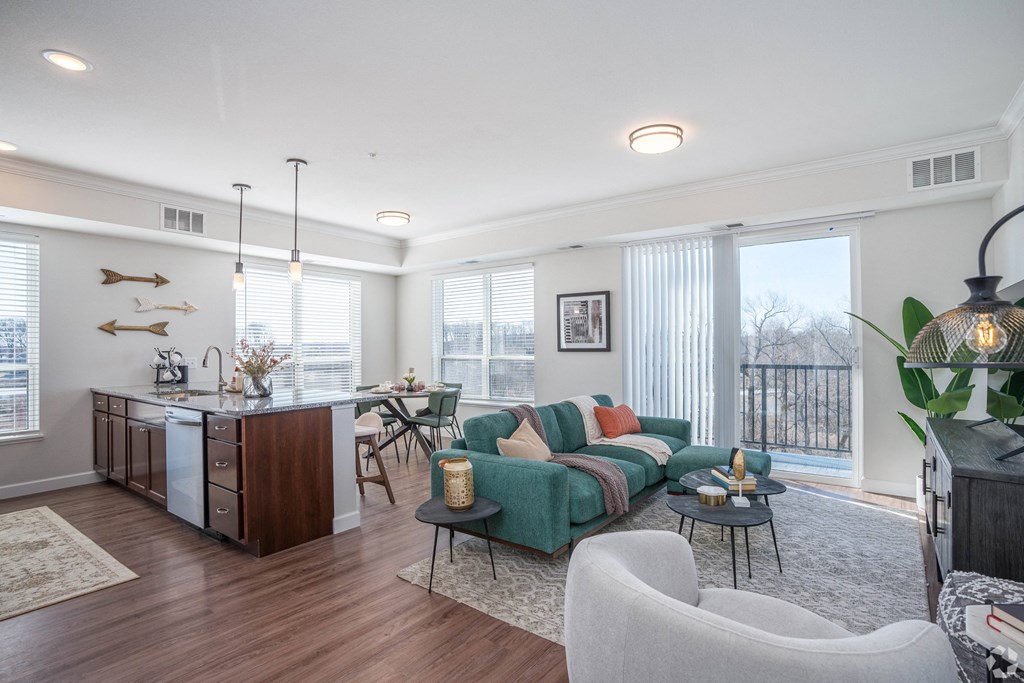 a living room with a couch and a table with chairs
