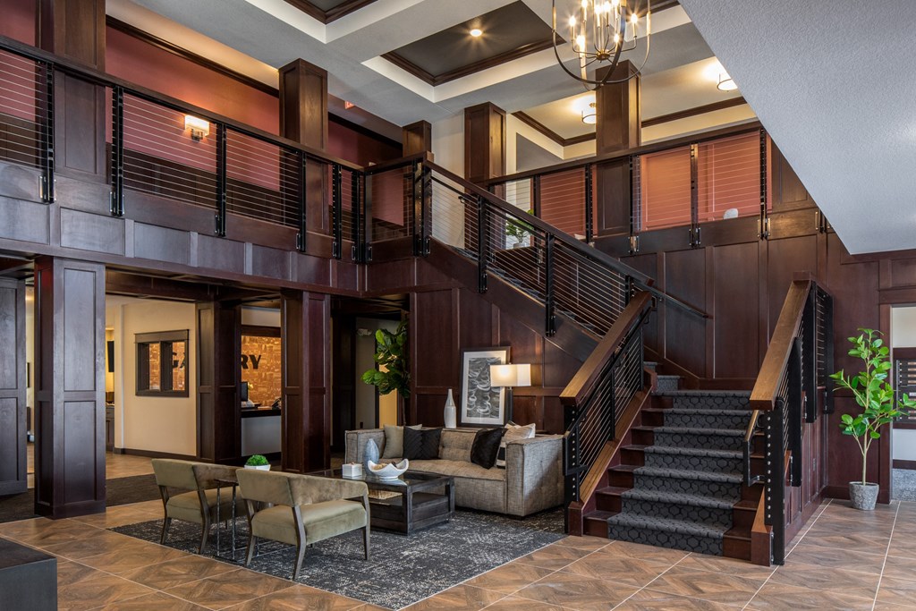 a lobby with a staircase and couches at The Gallery Apartments, Minnesota