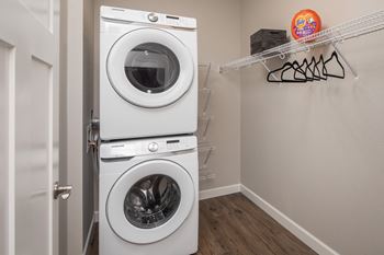 a washer and dryer in a laundry roomat The Carver Apartments, Chaska, MN 55318