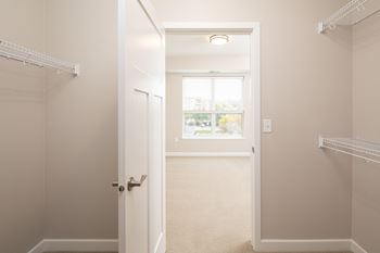 a walk in closet in a 555 waverly unitat The Carver Apartments, Chaska Minnesota